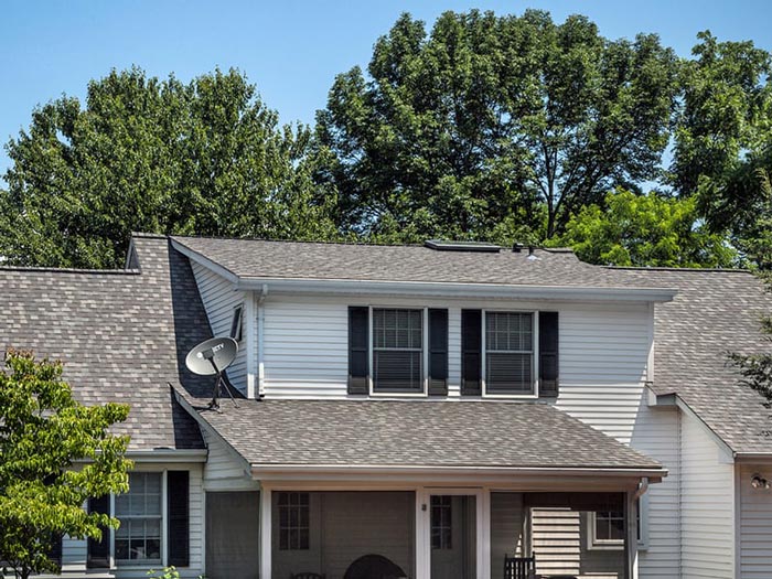 light gray house with dark gray roof