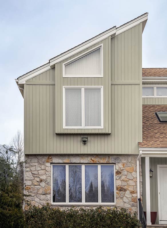 house with tan vertical siding