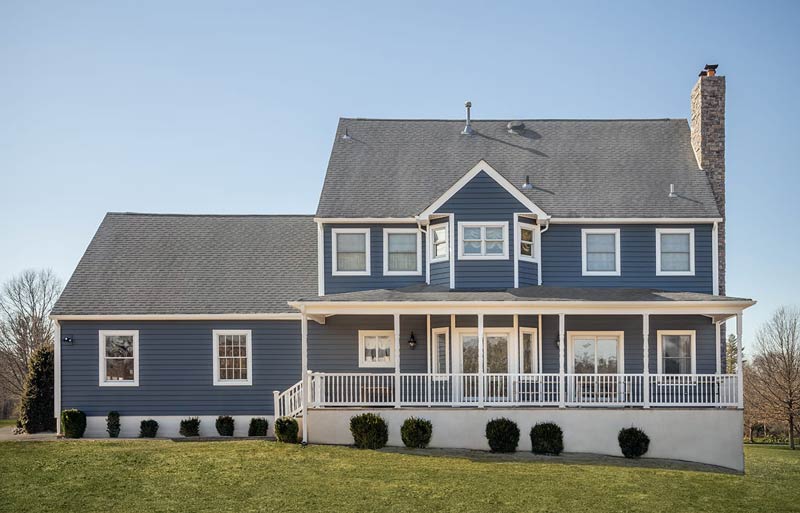 back of dark blue house