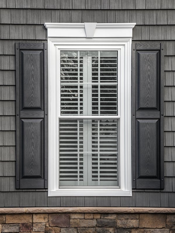 white window with dark shutters