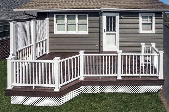 small back deck with white fence
