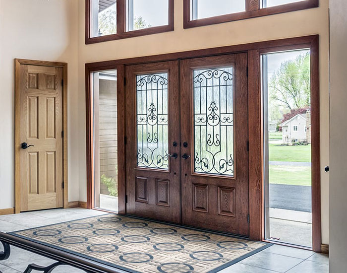 brown, detailed front door with large windows