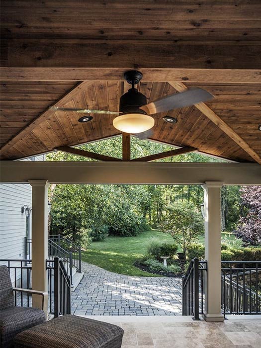 covered back porch with ceiling fan