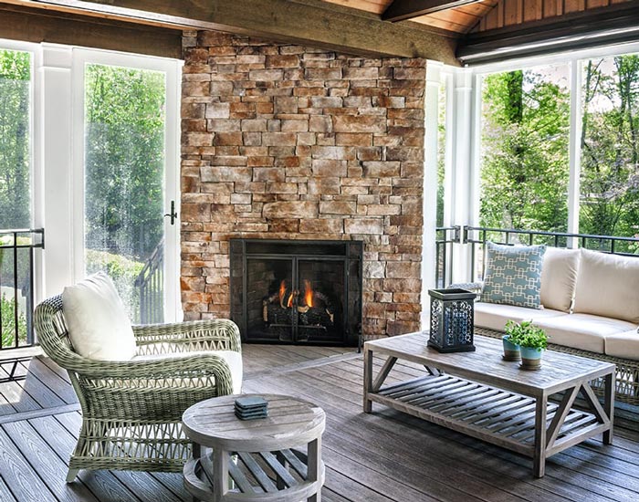 sunroom with brick fireplace